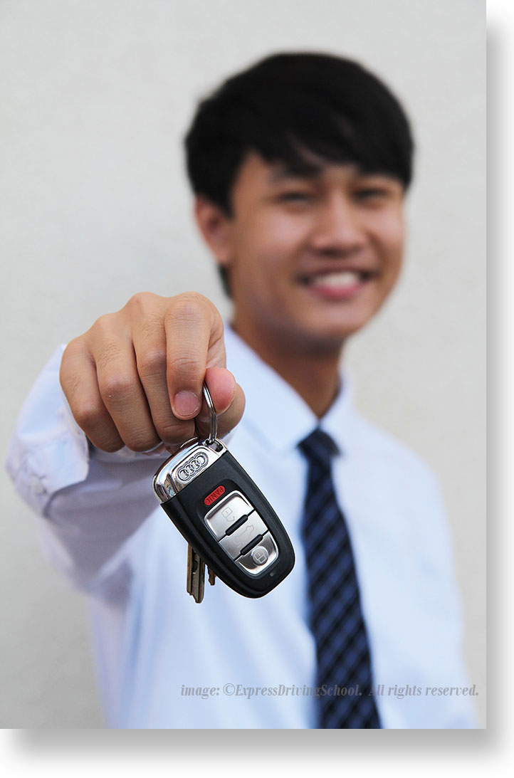 teen holding keys